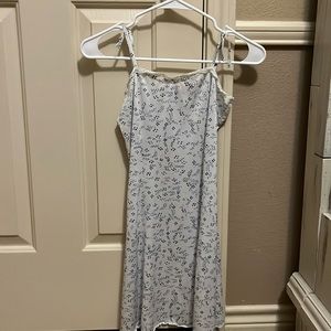 white dress with blue floral pattern